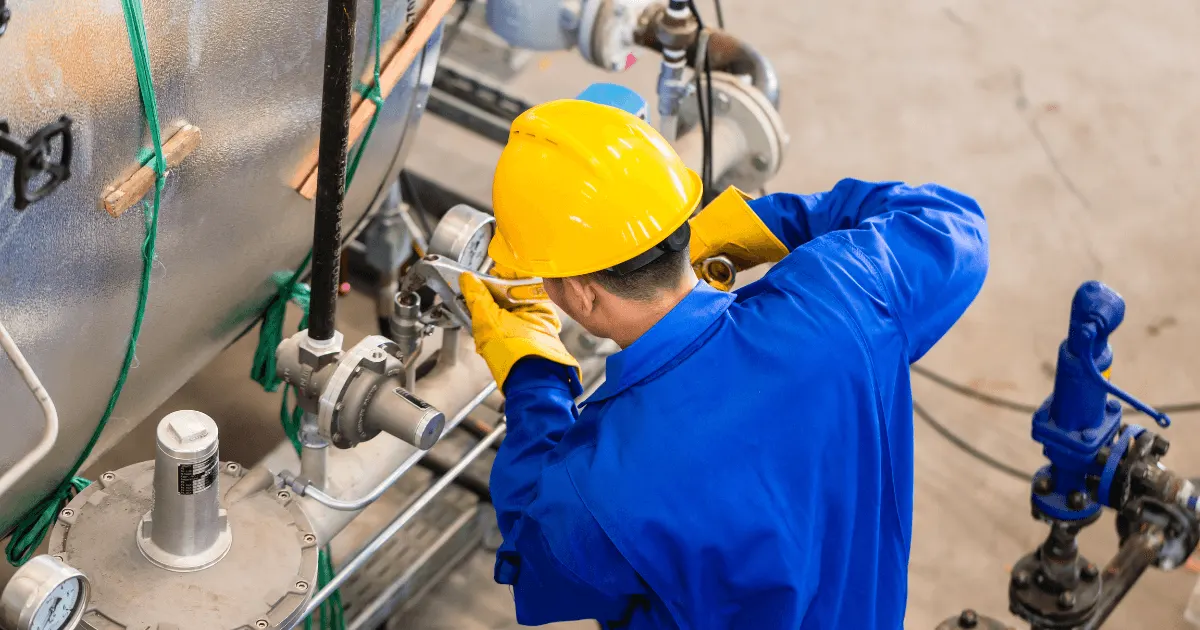 Summit-Health_Workplace-Exposure Employee working with safety gear in a factory
