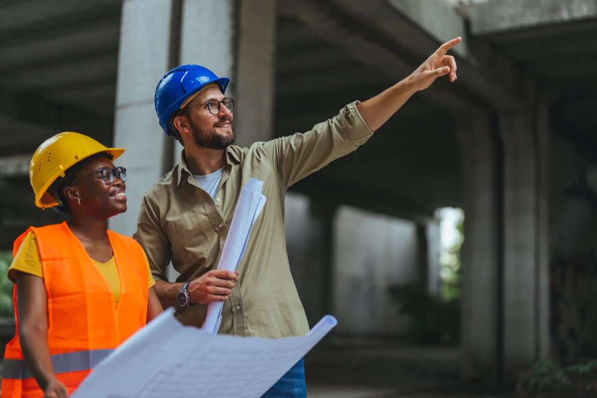 an image of a foreman explaining the types of hazards defined by industrial hygiene to an employee.